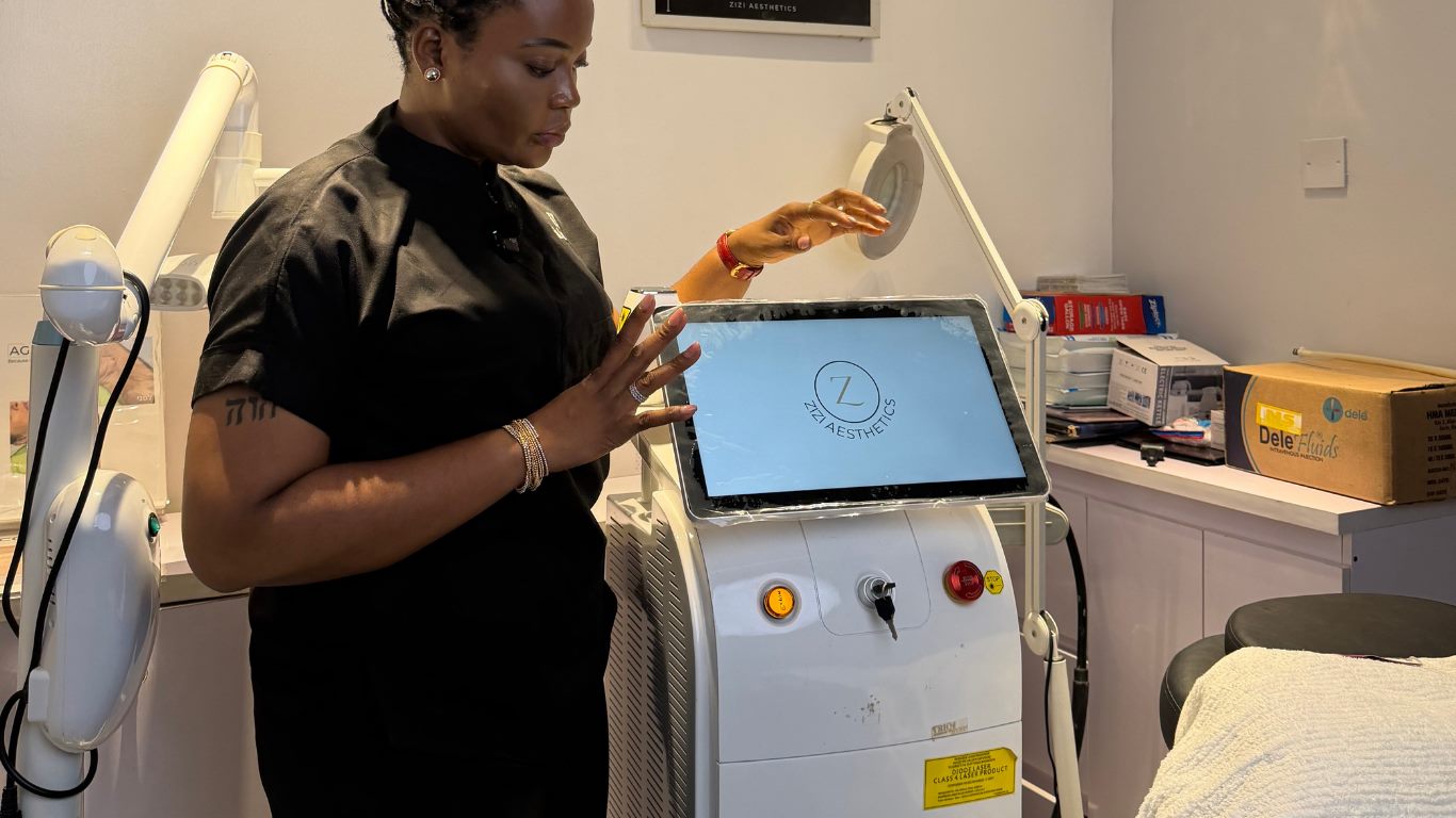 A Zizi Aesthetics practitioner operating clinical laser equipment