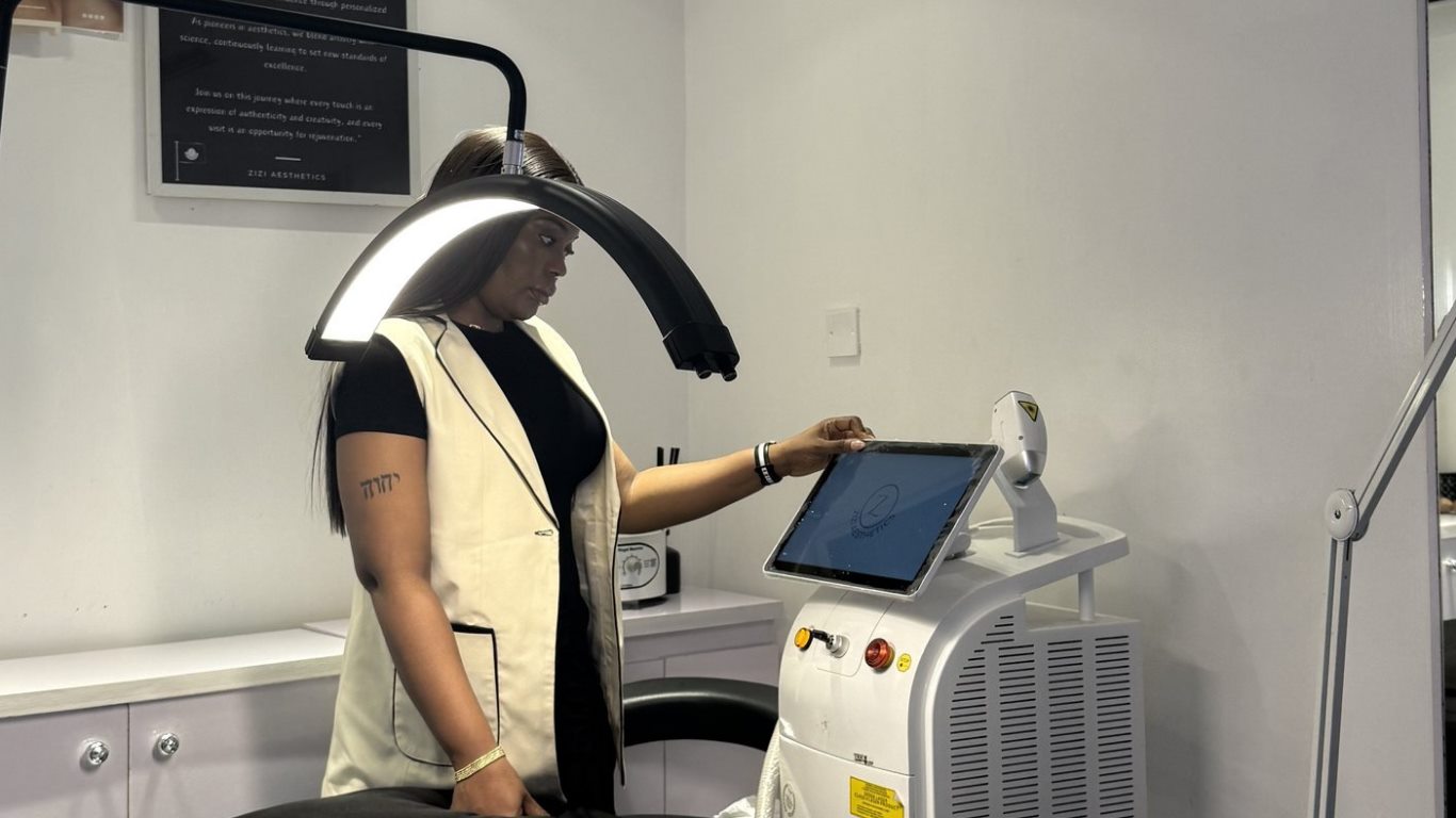 Practitioner preparing laser treatment at Zizi Aesthetics